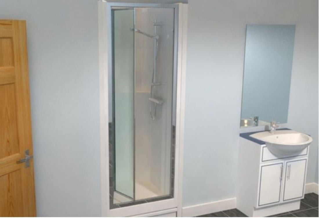 A modern bathroom with a shower pod installed to provide a leak free solution. 