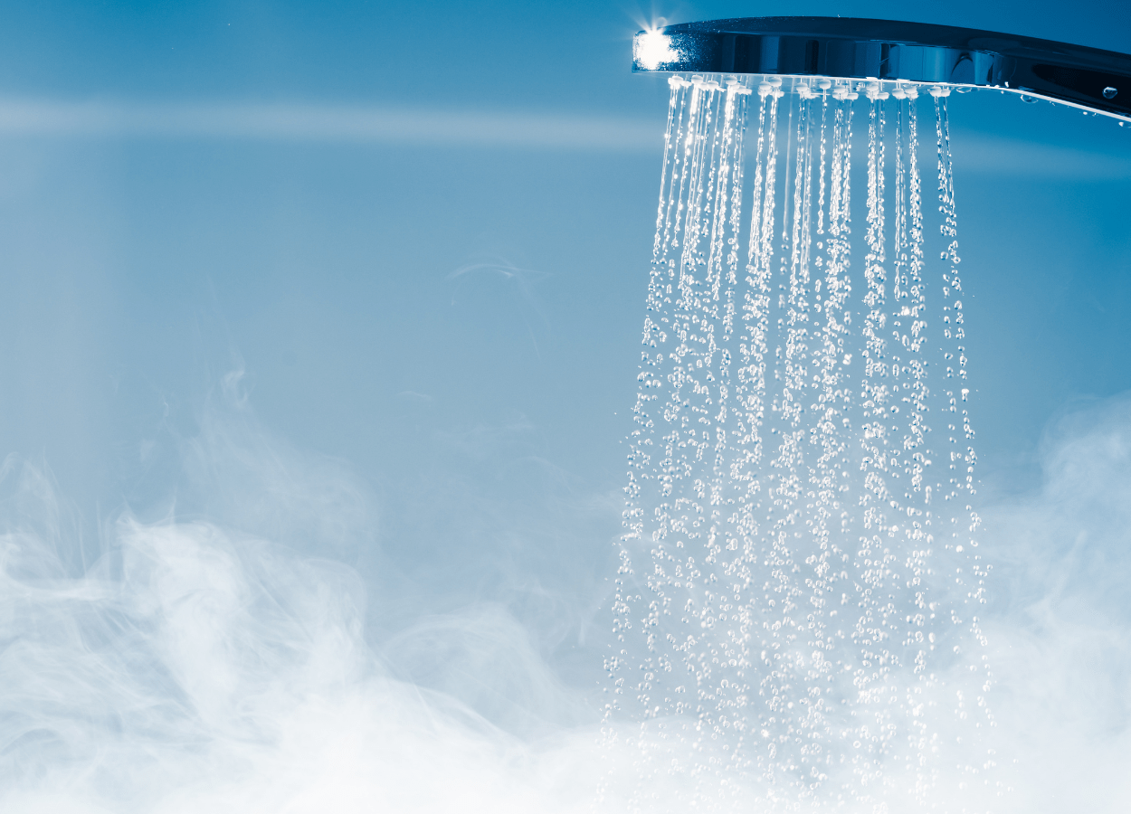 Running shower filling a cramped bathroom with steam underscoring space limitations and highlighting the need to maximise space.