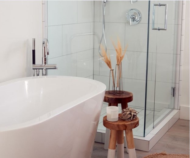 A modern bathroom with a bathtub and a self-contained shower cubicle