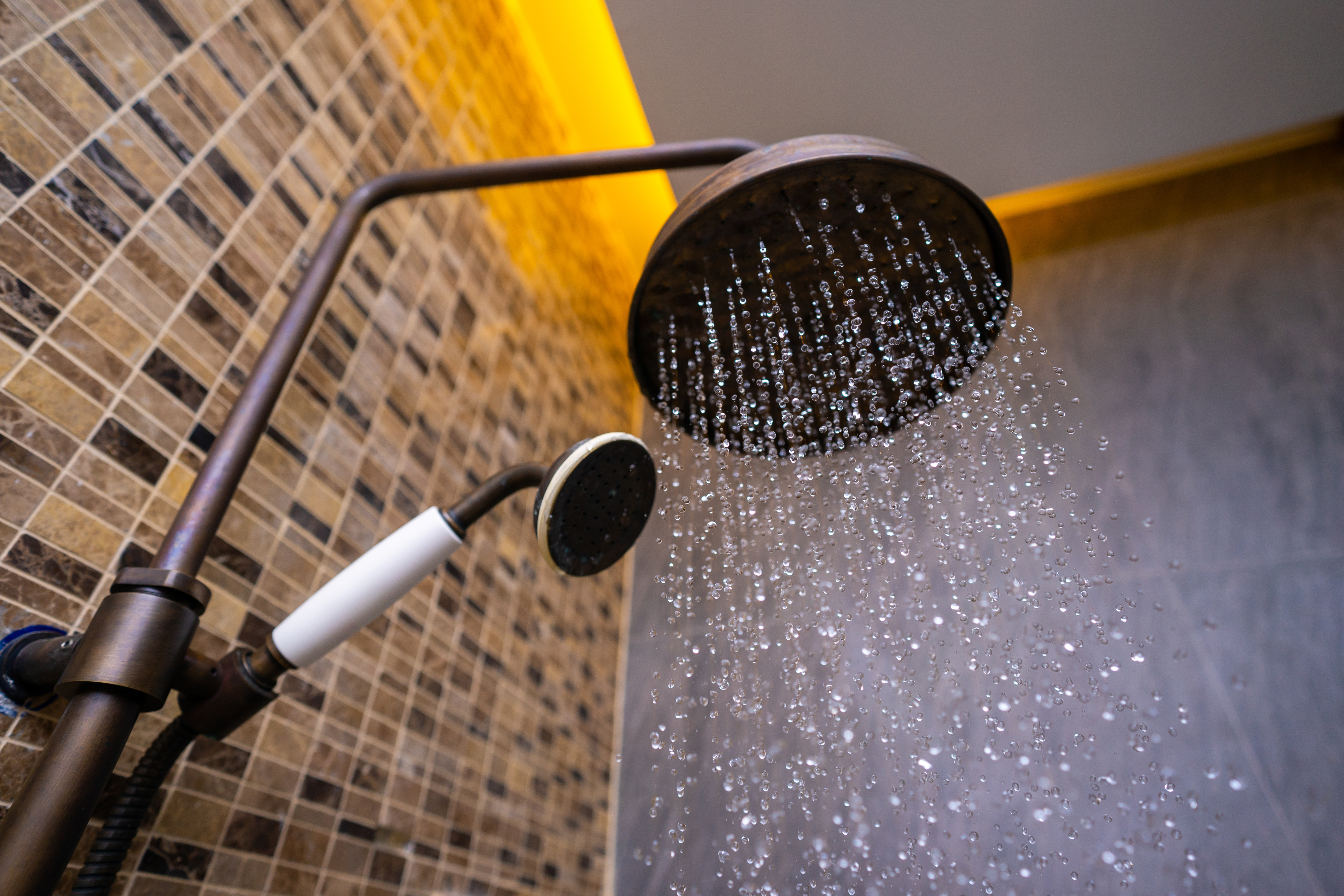 high amount of water coming out of shower head to show what causes a shower to flood