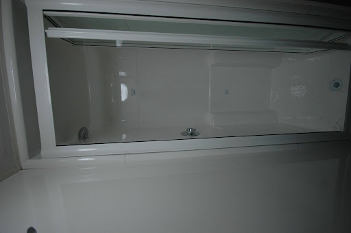 Modern glass shower cubicles with sleek low-maintenance bathroom design and enclosed shower space.