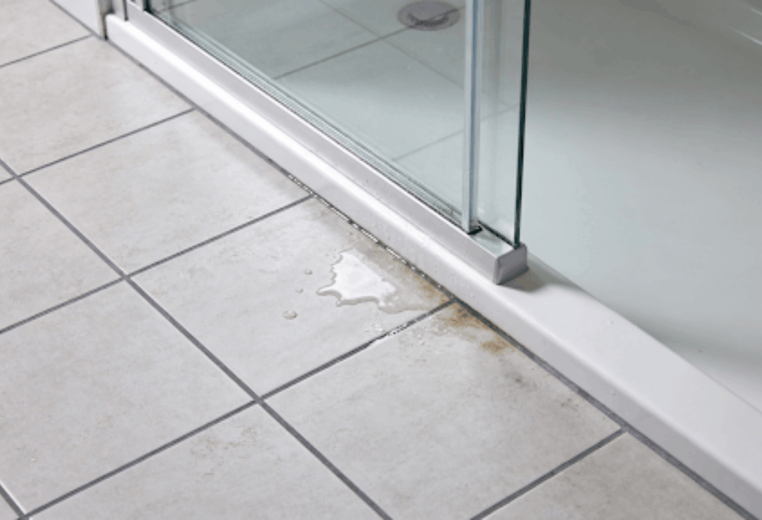 A leak on a shower floor which was found by researching how to find a leak in a shower cubicle.