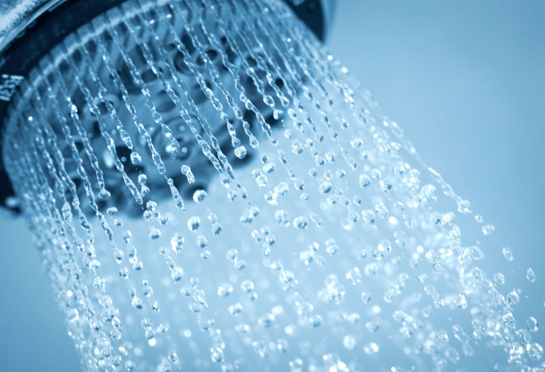 A shower head with water coming out of it showing a new style for a selection.